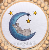Bunny sleeping on moon