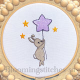Bunny flying with star balloon