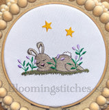 Bunny sleeping in field