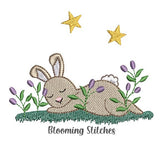 Bunny sleeping in field
